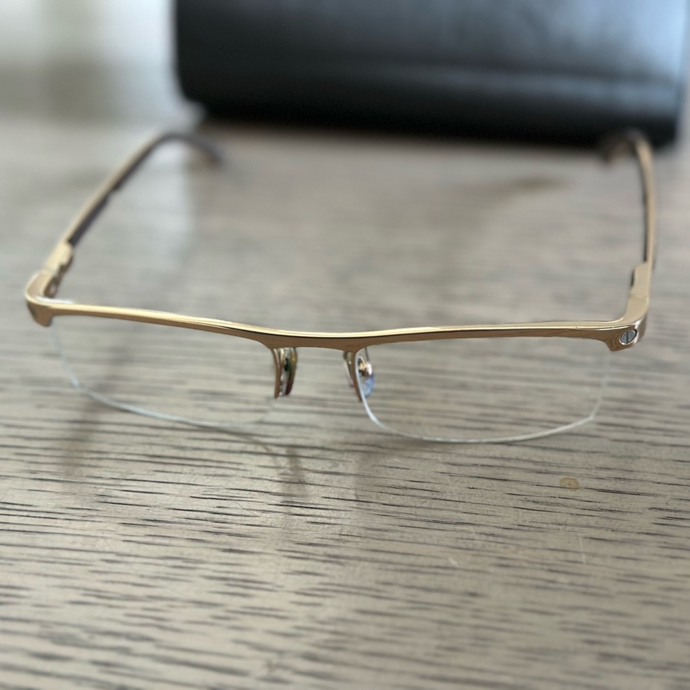 Cartier gold frame glasses.